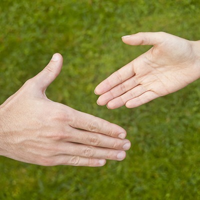 Young man and woman shaking hands